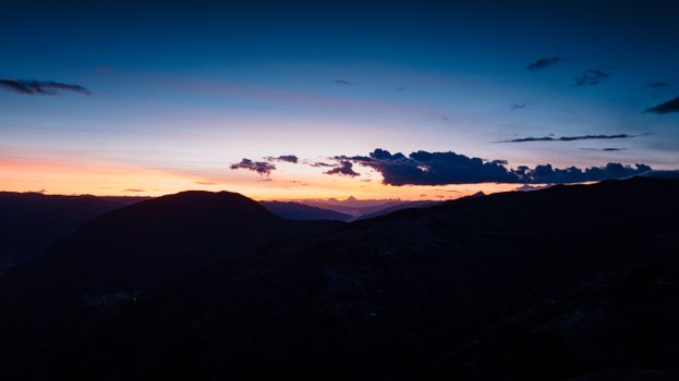 Captivating sunset view over the Andes near Cusco, Peru with dramatic silhouettes.