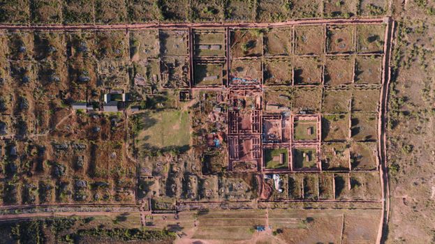 A breathtaking aerial perspective of ancient ruins in Cusco, Peru, showcasing intricate layouts.