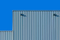 Steel Construction of a Building Against a Blue Sky