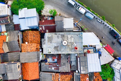 Bird's-eye Photography of Houses Beside Road