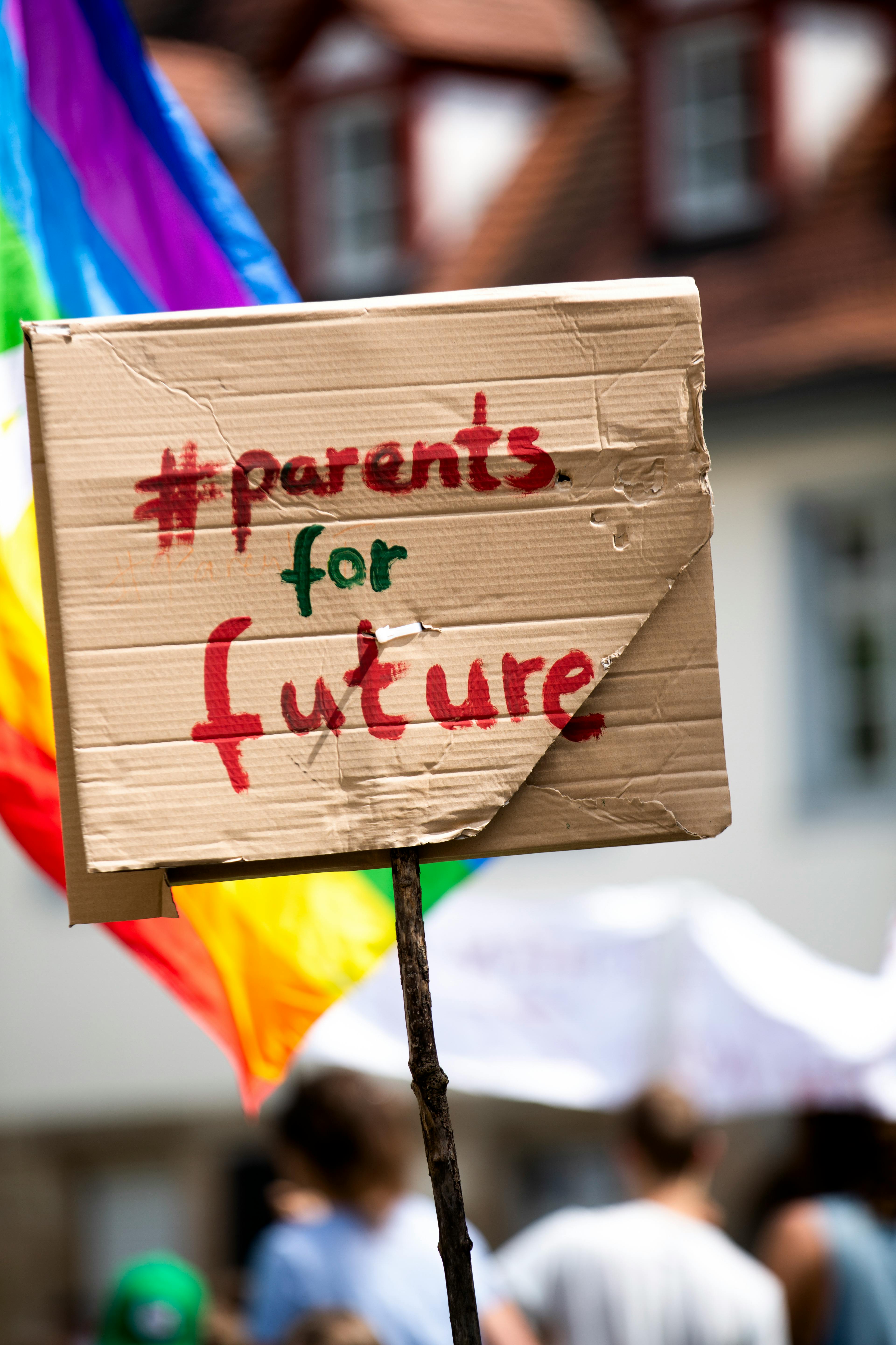Cardboard sign with '#parents for future' at a climate protest in Erlangen, Germany.