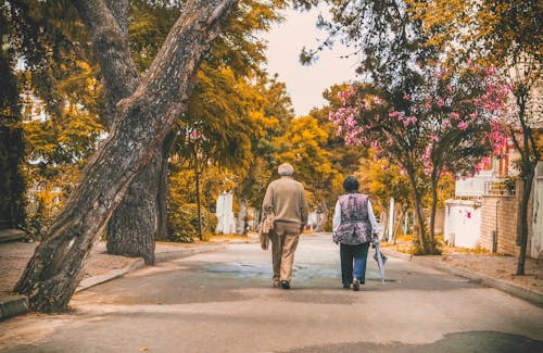 Man And Woman Walking On The Street