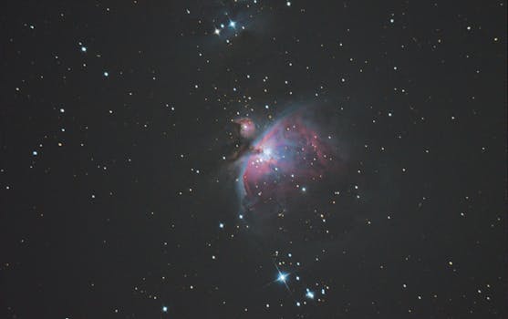 Capture of the Orion Nebula showcasing its vibrant colors and surrounding stars, a celestial marvel.