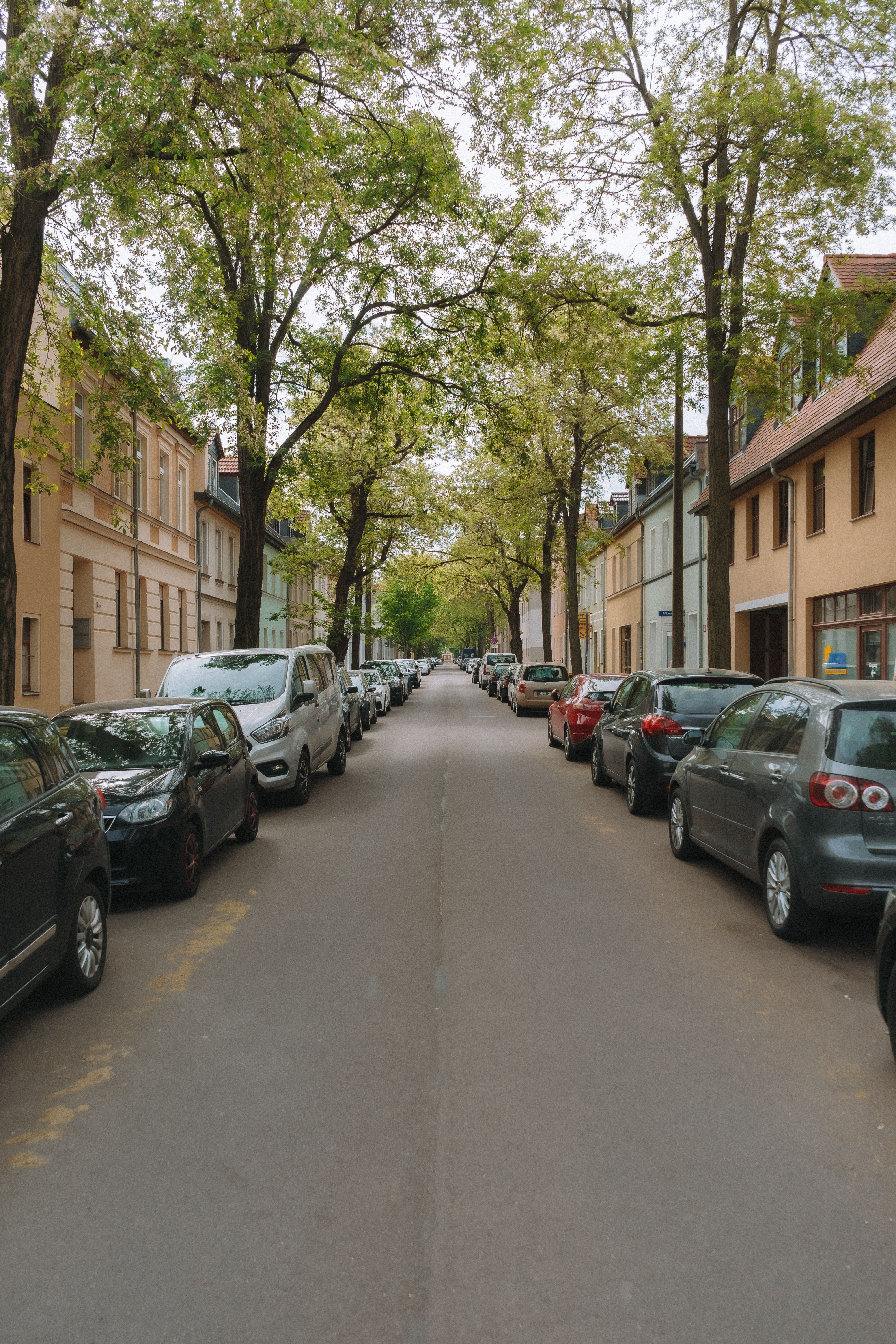 Cars Parked on Both Sides of Street in Town · Free Stock Photo
