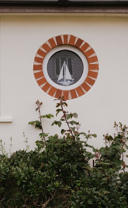 A window with a sailboat on it