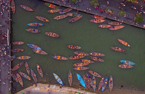 A large group of boats in a body of water