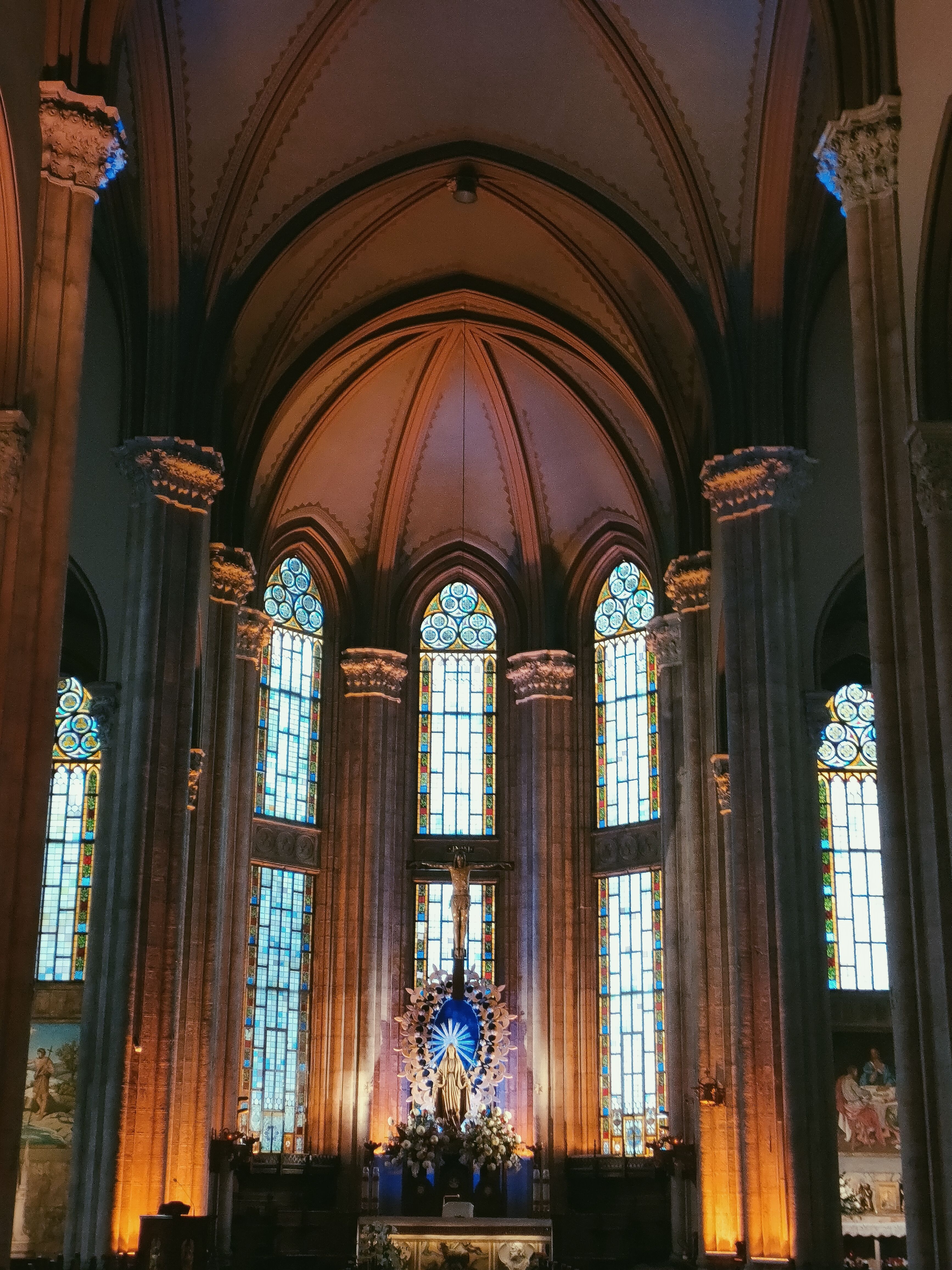 The interior of a church with stained glass windows · Free Stock Photo