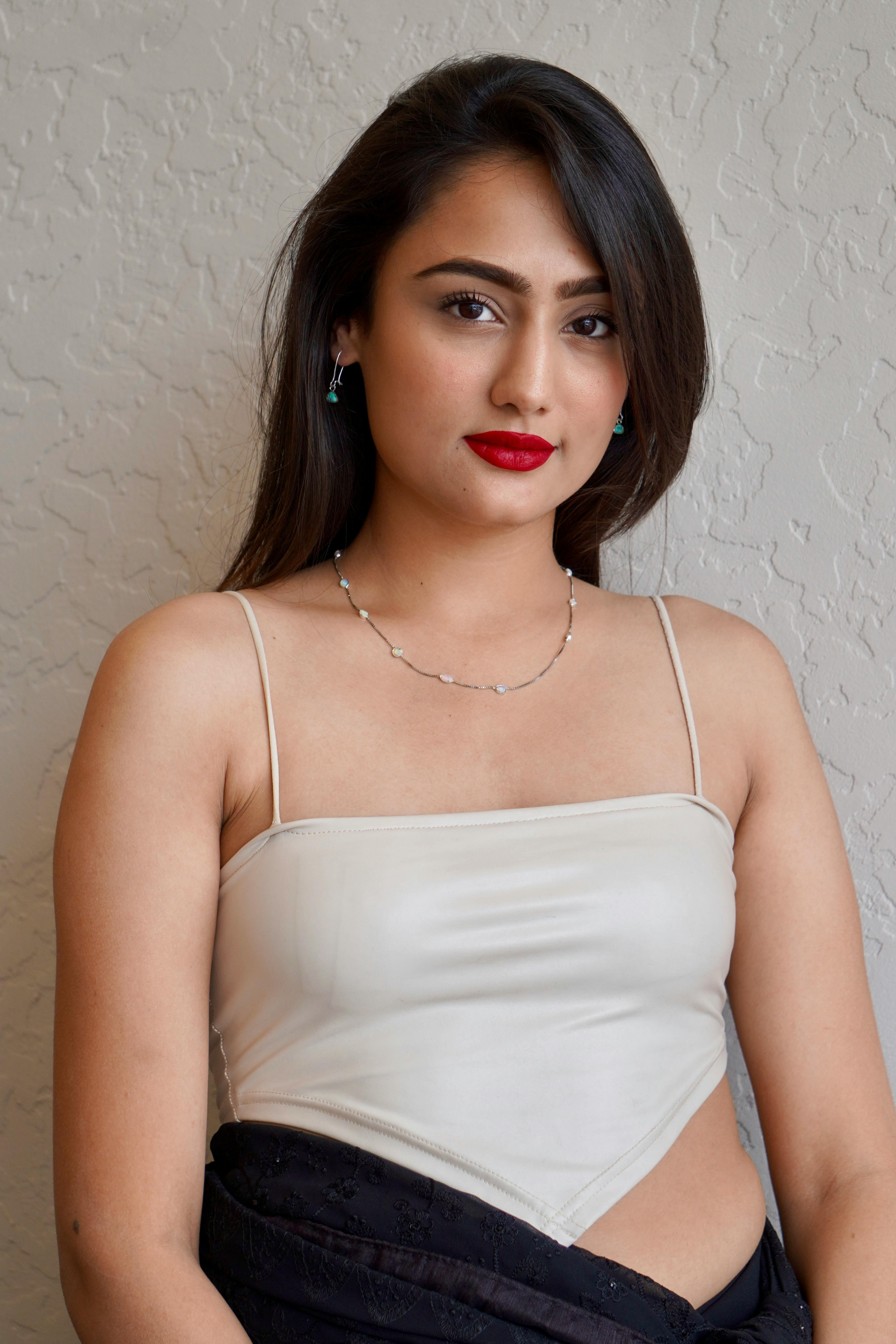 model in silver jewelry and white blouse