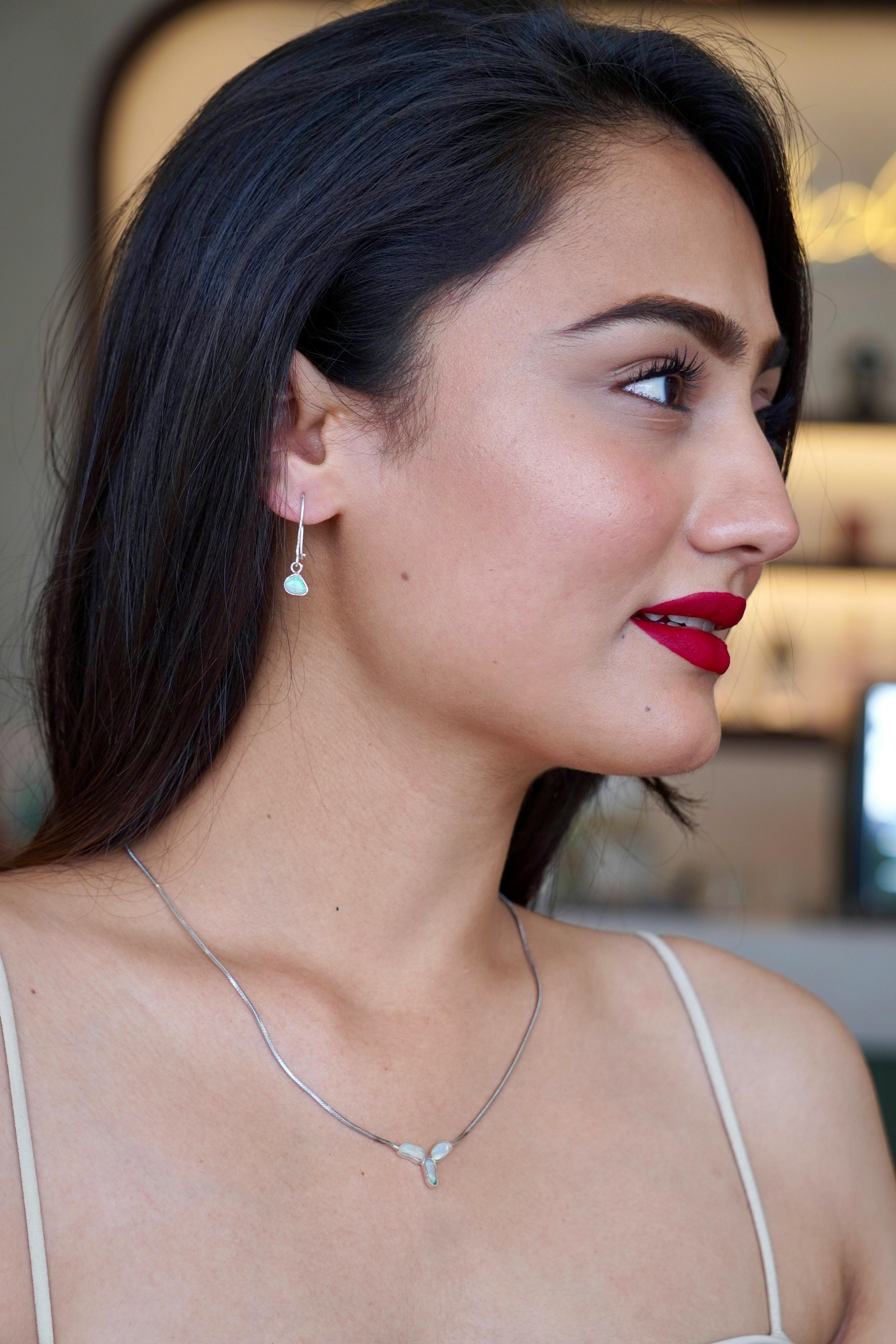 model posing in silver jewelry