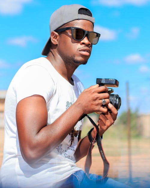 Безкоштовне стокове фото на тему «афроамериканський чоловік, дозвілля, камера»