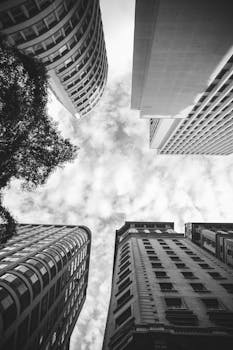 Low angle view of modern skyscrapers in São Paulo, Brazil, with dramatic clouds.