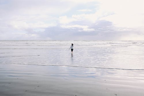 Woman Standing On Shore