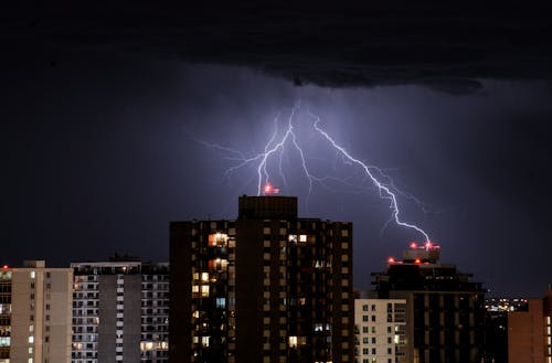 Free A Lightning Stroke In The Night Sky Stock Photo