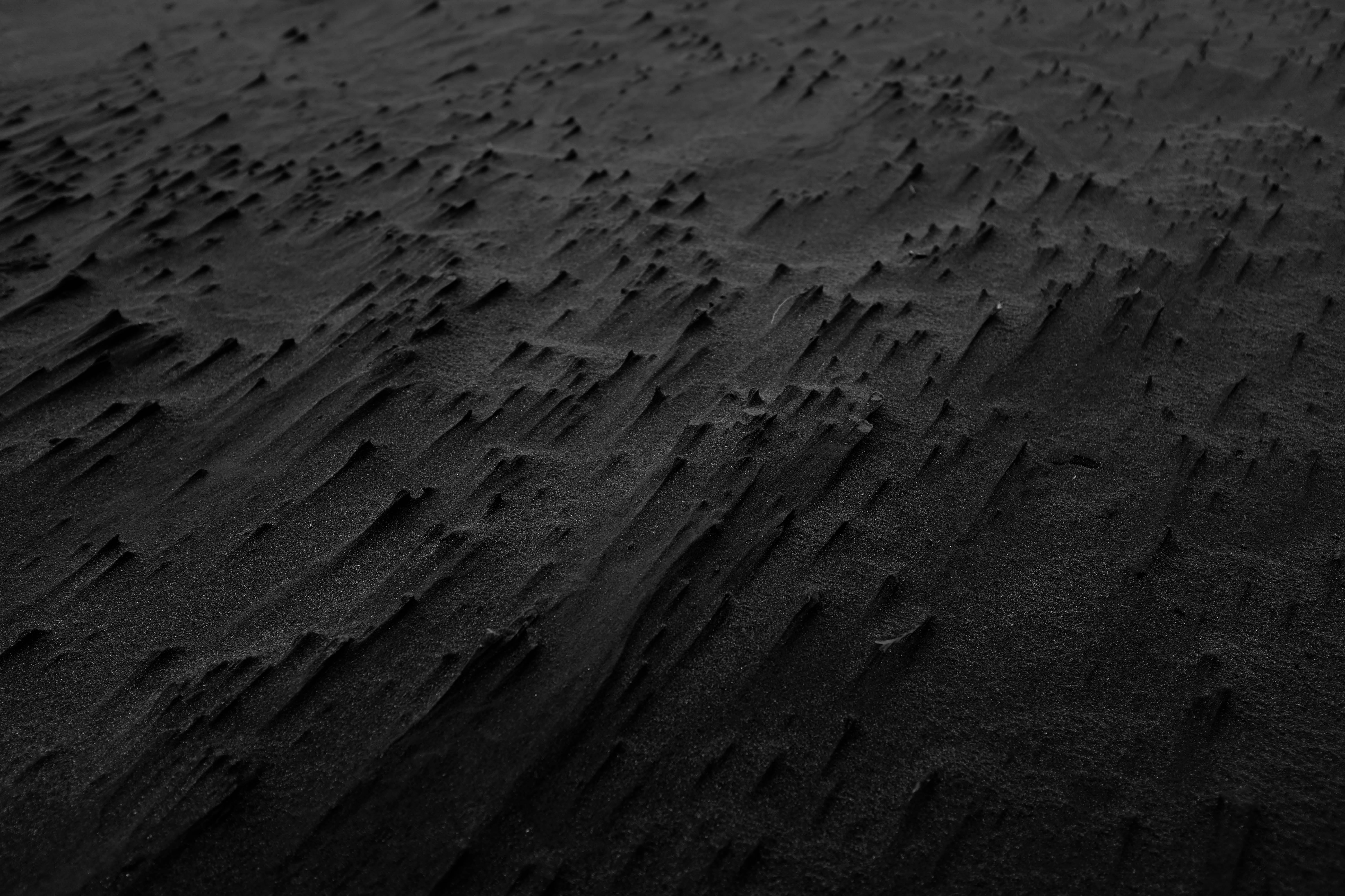 black and white photography of sand