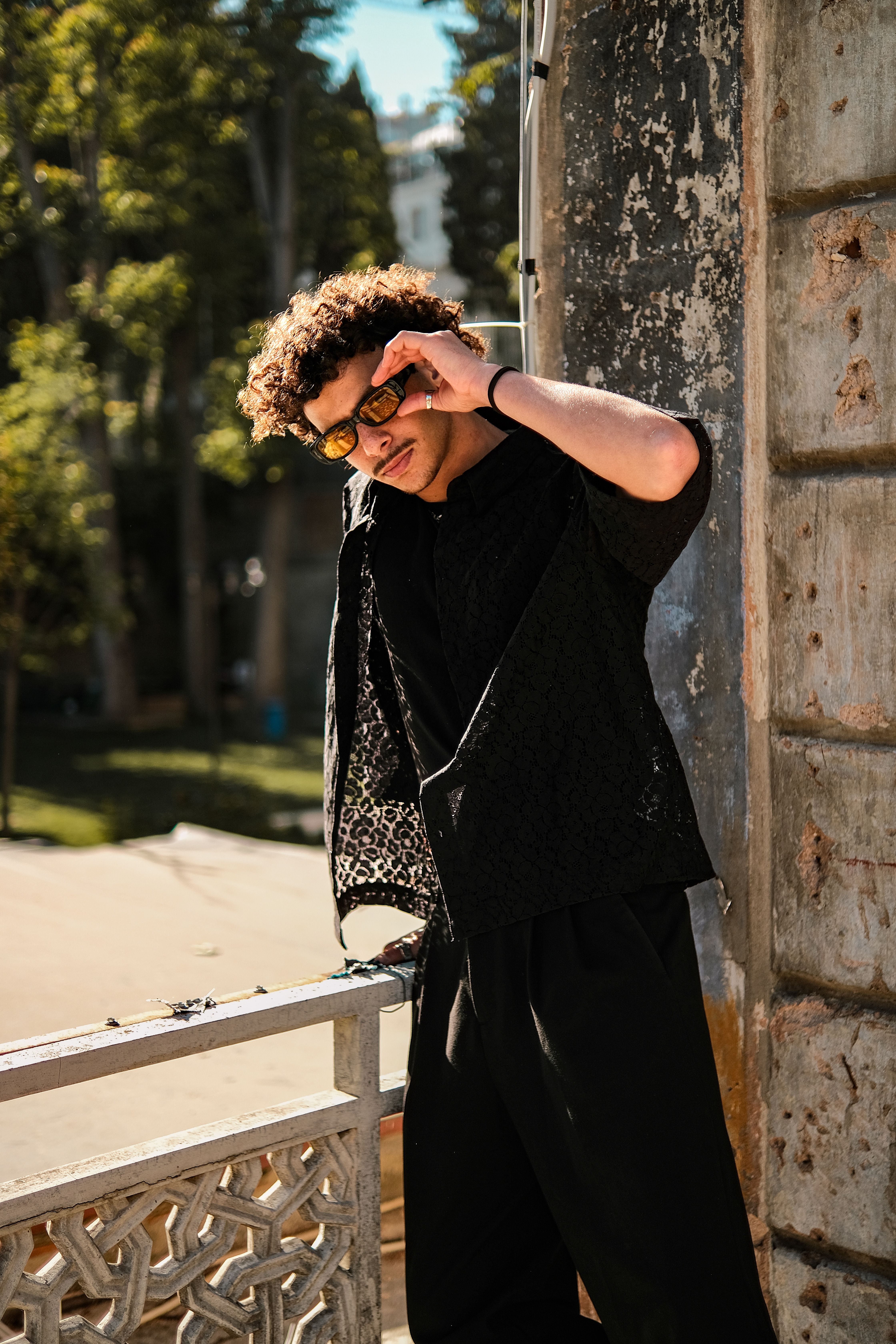Man Wearing Black Clothes in Front of Brick Building · Free Stock Photo