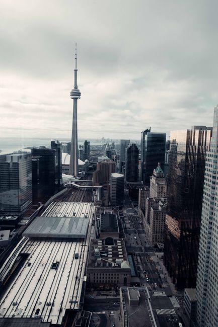 A breathtaking aerial view of Toronto's skyline with the iconic CN Tower, capturing urban architecture.