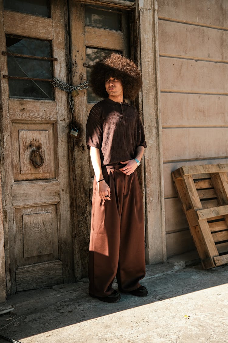 Man With Afro Standing Near Door