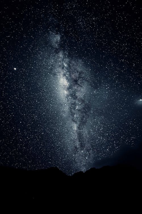 Silhouette of Mountain Under Starry Night