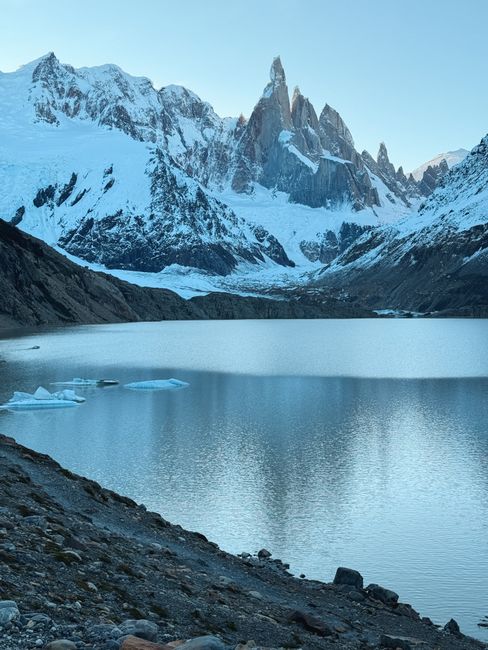 Stunning winter landscape of Fitz Roy overlooking a serene lake in Santa Cruz, Argentina.
