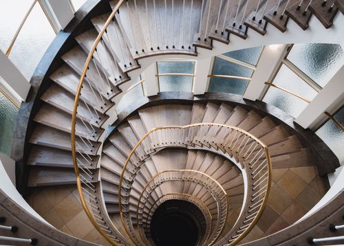 Free A stunning spiral staircase in Hamburg viewed from above, featuring elegant design. Stock Photo
