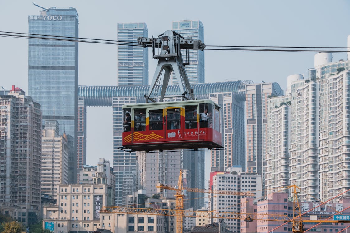 Free Chongqing's iconic cable car traversing the skyline, showcasing urban architecture. Stock Photo