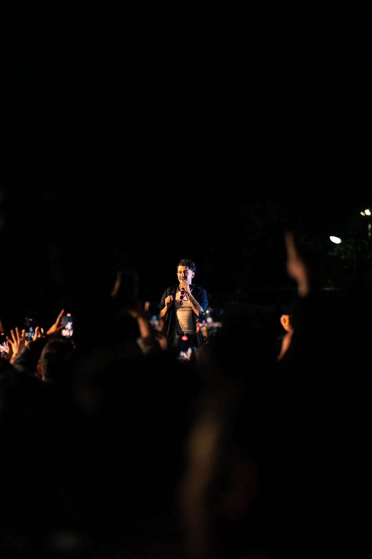 Artist performing for a night-time audience