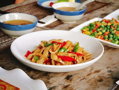A vibrant vegetable dish with peppers and beans served on a rustic table, perfect for food photography.