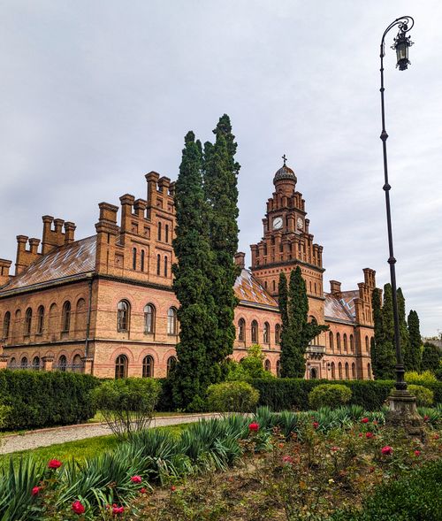 Free Stunning view of Chernivtsi University showcasing its classic architecture and lush gardens. Stock Photo