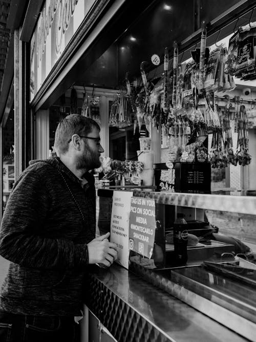 Free stock photo of black and white, man, snack bar