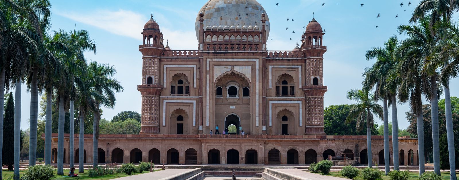 Beautiful view of Safdarjung's Tomb and garden, showcasing Mughal architecture under a clear blue sky.