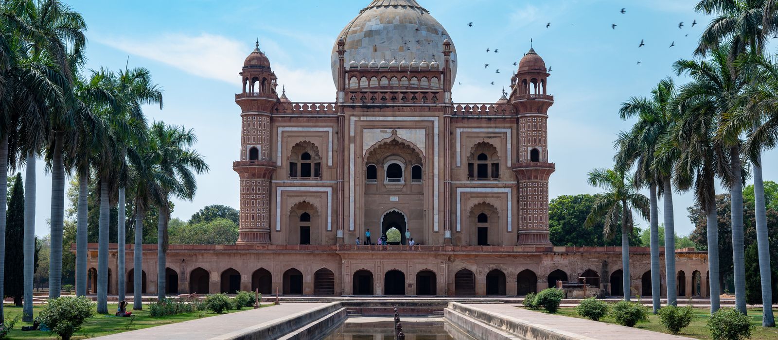 Beautiful view of Safdarjung's Tomb and garden, showcasing Mughal architecture under a clear blue sky.