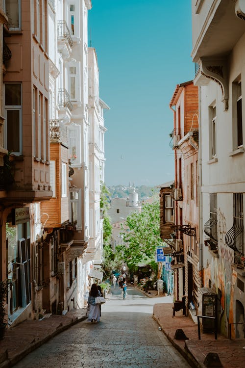 A person walking down a narrow street in istanbul