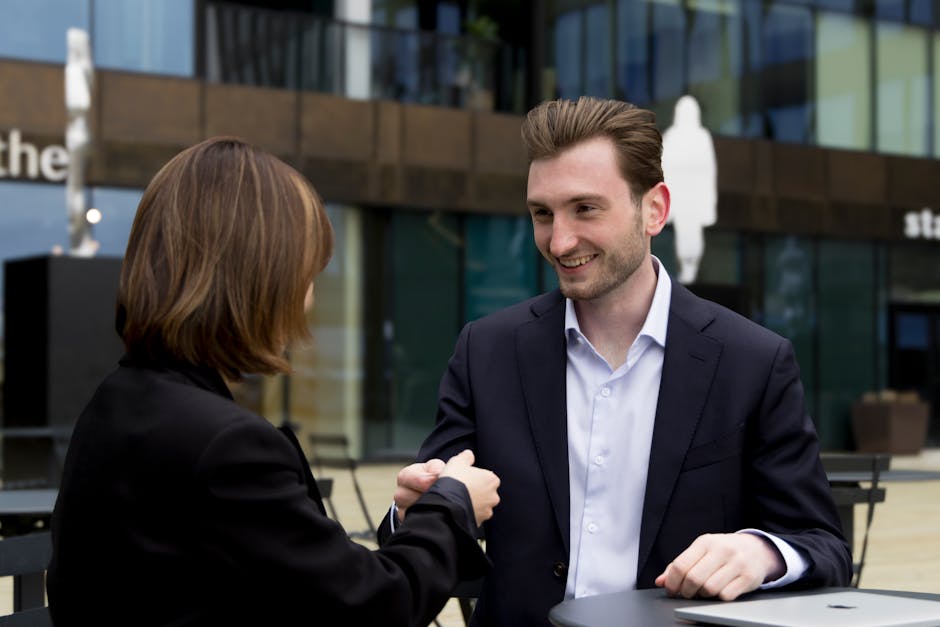 Two professionals networking at a product launch event with reusable expo kit