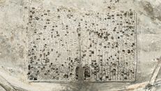 Aerial shot of an ancient graveyard in the Atacama Desert, Chile, displaying intricate patterns and historical significance.