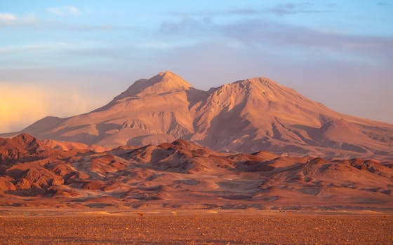 Breathtaking view of mountains in the Atacama Desert, Chile, during a vibrant sunset.