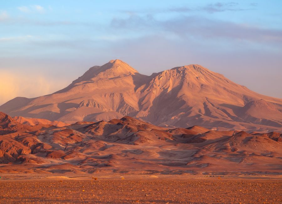 Breathtaking view of mountains in the Atacama Desert, Chile, during a vibrant sunset.
