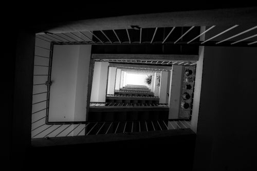 Free Abstract view of a modern staircase in grayscale, showcasing architectural design. Stock Photo