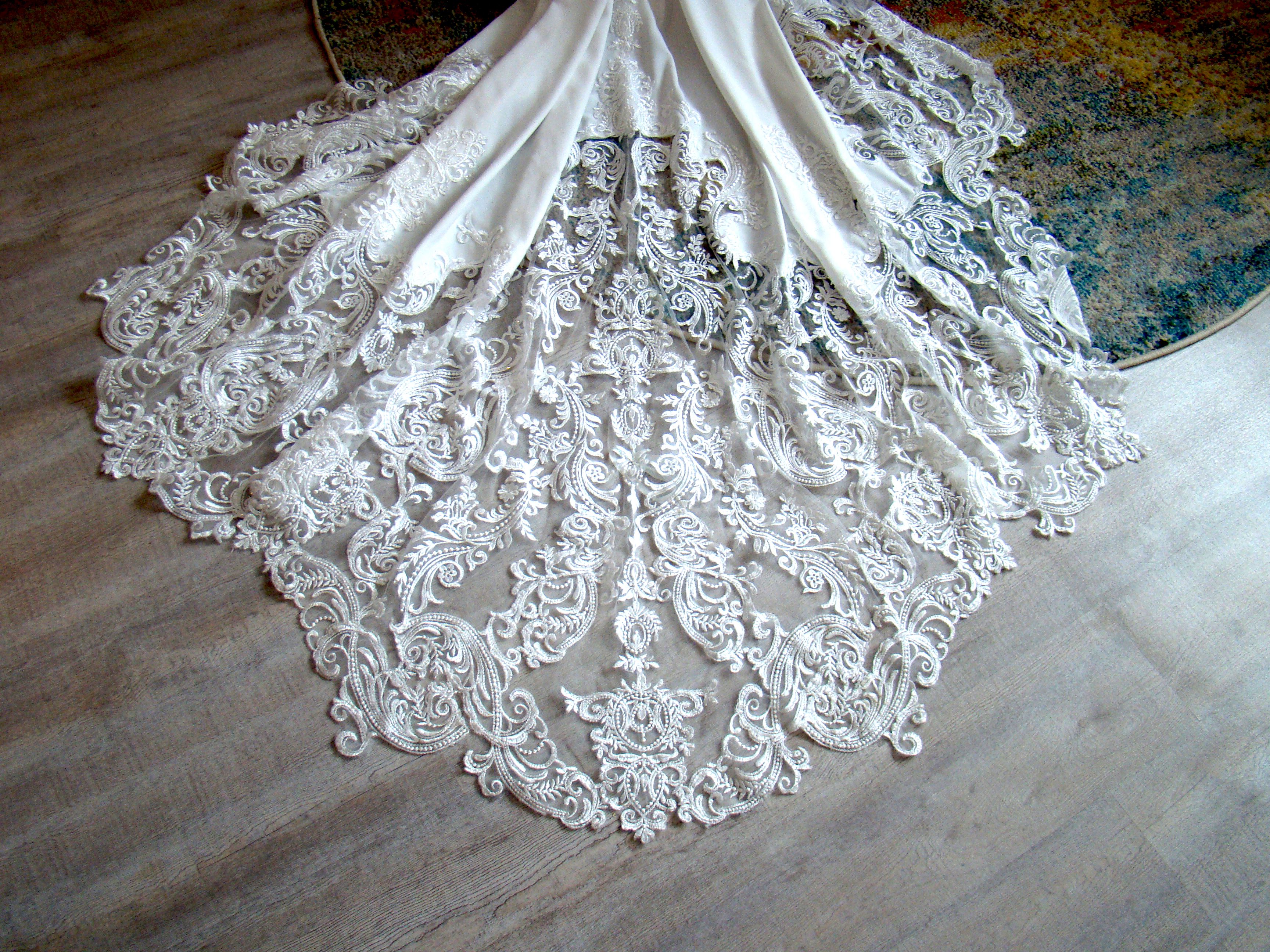 Bustled wedding gown train showcasing elegant back detailing