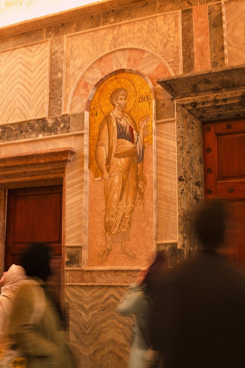 A painting of jesus on the wall of a building