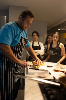 A chef teaches a cooking class in Samsun, Türkiye, demonstrating precise burger preparation.