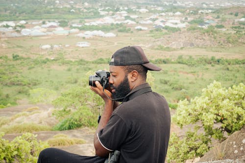 A man taking a photo of a mountain