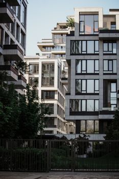 A view of contemporary buildings with minimalist design in an urban setting.