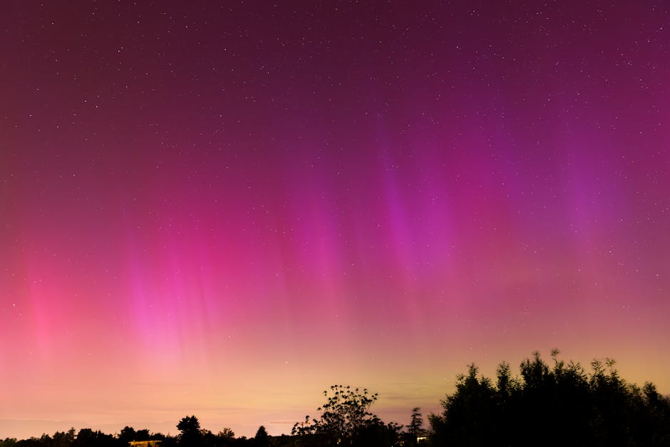 Vibrant aurora borealis illuminates the night sky over Geneva, creating a stunning natural display.
