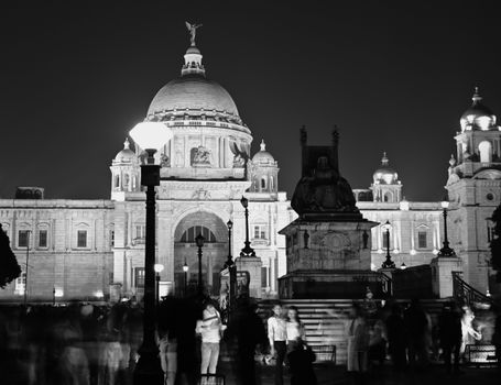 Black and white night view of the iconic Victoria Memorial in Kolkata, India.