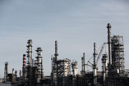 Refinery stacks at dusk — photo by Life Of Pix on Pexels