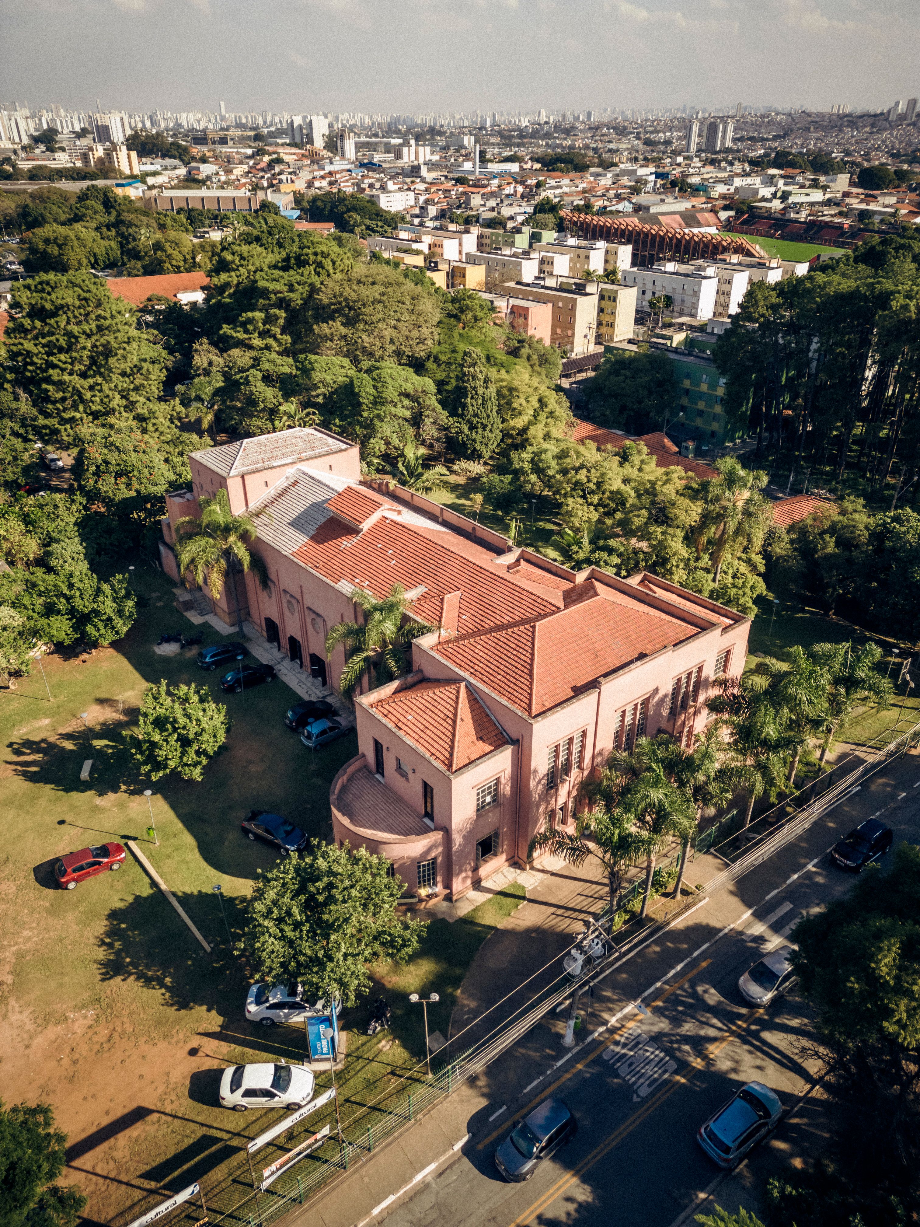 Aerial cityscape featuring Sanatorio Pe Bento amidst lush greenery in São Paulo, Brazil.