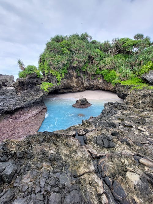 A beach with a blue hole in the middle