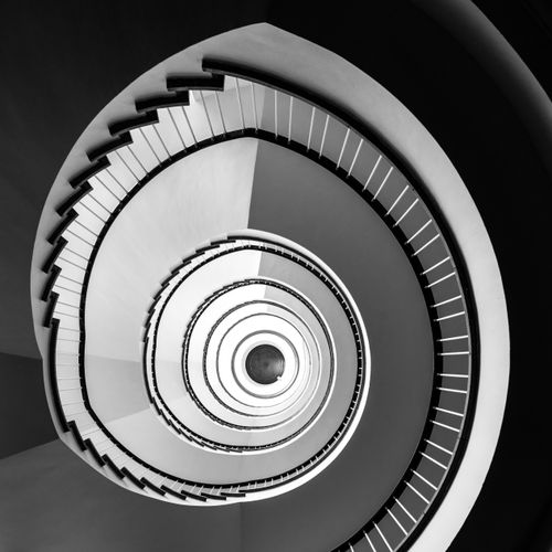 Free Black and white spiral staircase photographed from above in Hamburg, Germany. Stock Photo
