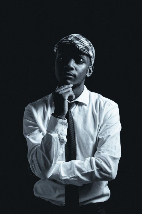 Free Elegant portrait of a well-dressed man in black and white with a confident pose. Stock Photo