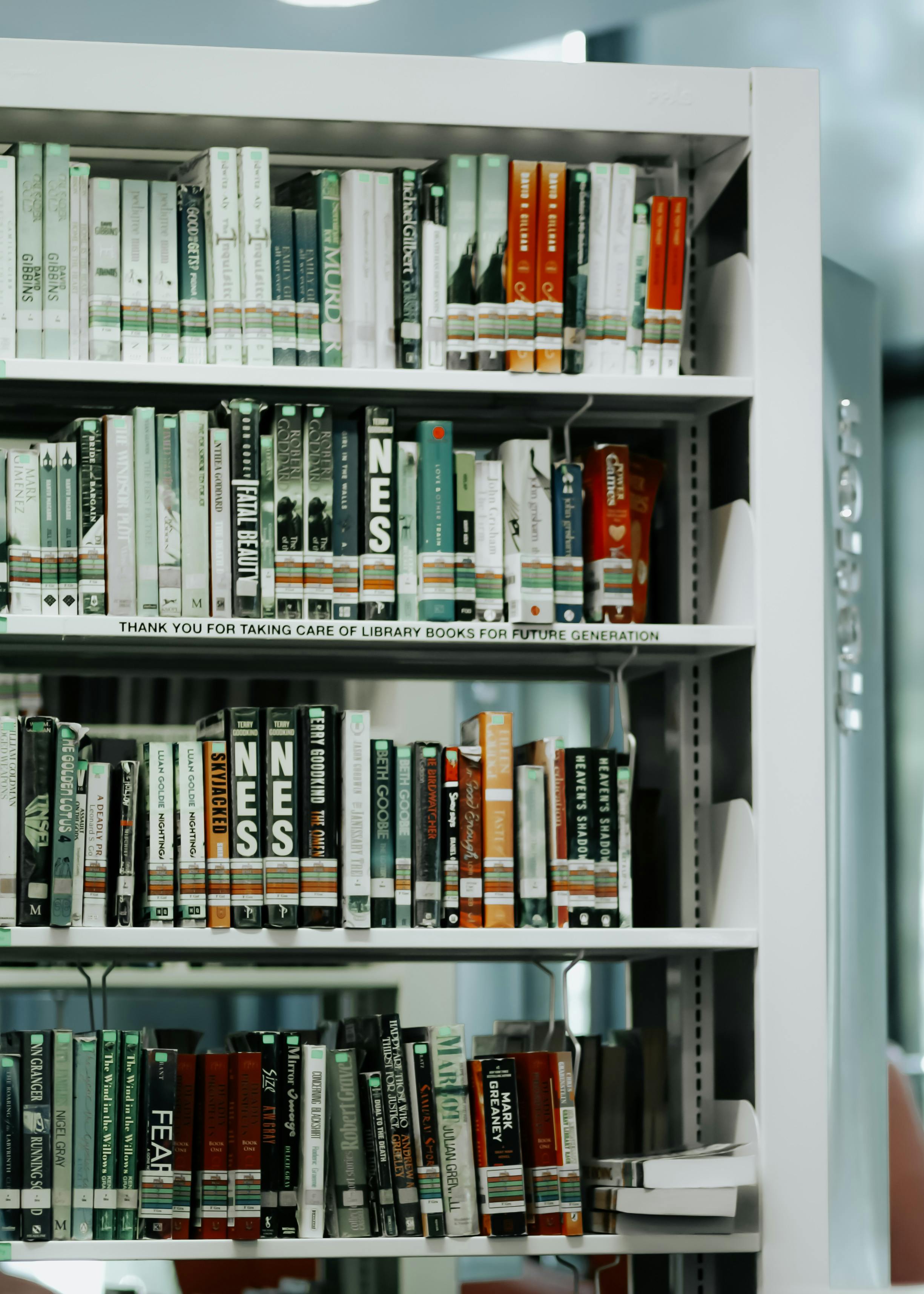 Neatly arranged books displayed on library shelves in Shah Alam, Selangor, Malaysia.